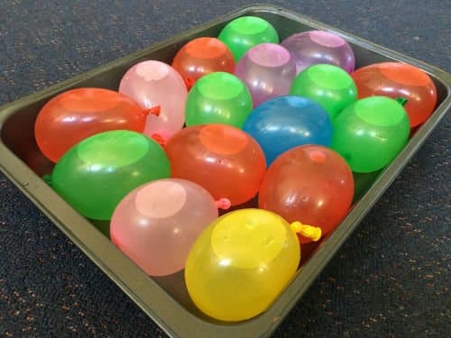 Water bombs for a STEM challenge in a baking tray