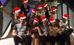 Fizzics team sittig down with Santa hats on for the 2015 christmas party in Sydney