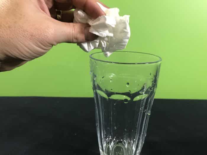 Air takes up space science experiment - adding tissue paper to an empty glass