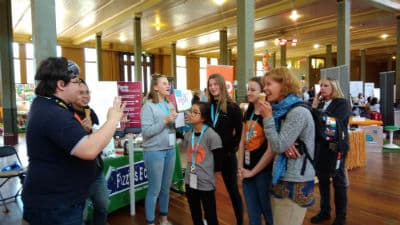 Ben from Fizzics telling a funny to story to girls and women while they eat ice cream