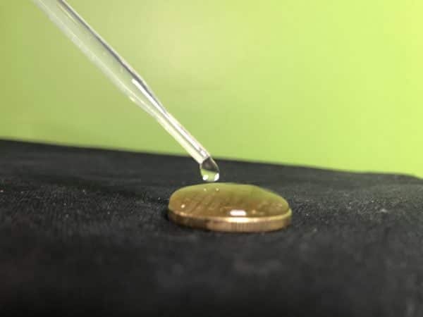 water drops on a coin experiment