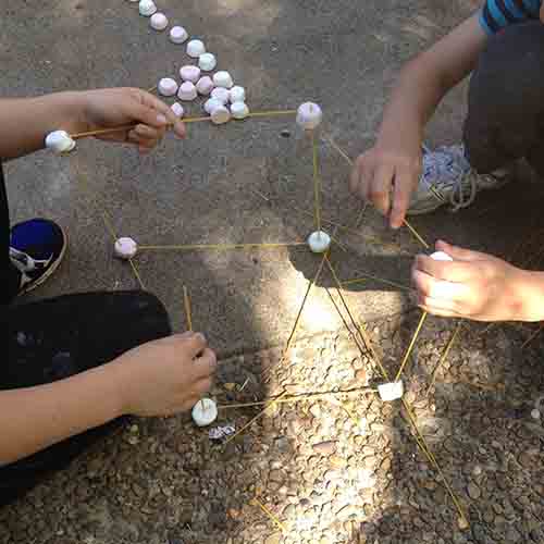 Forming a cube shaped marshmallow tower